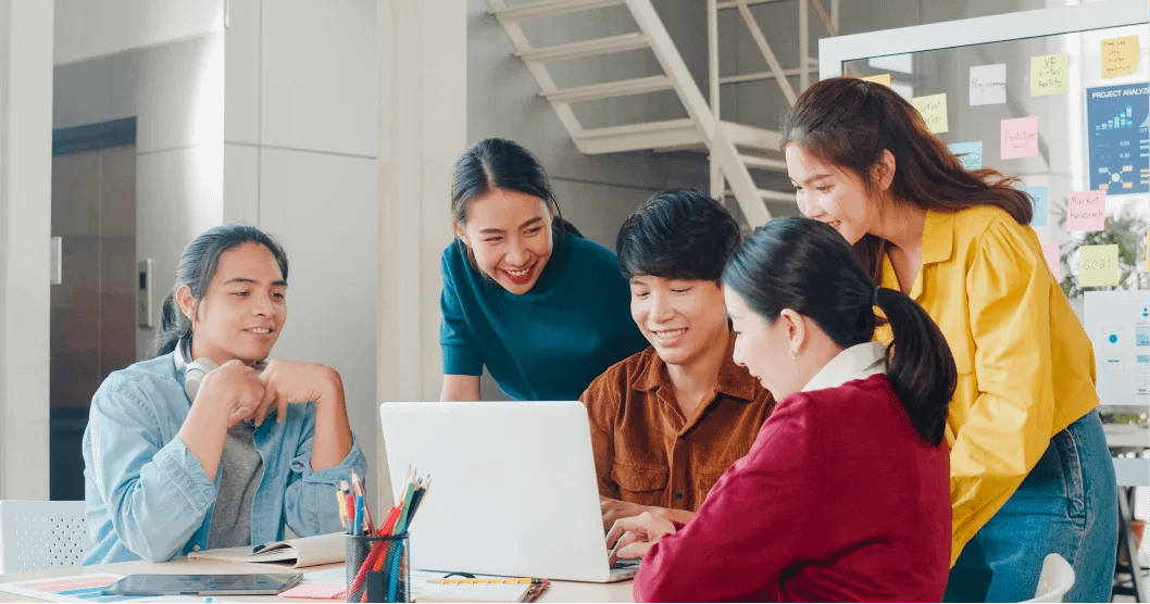 people at the meeting looking at the laptop screen