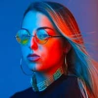 woman in colorful environment looking at the camera