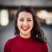 white woman smiling at the camera