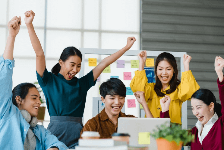 people cheering the success at work